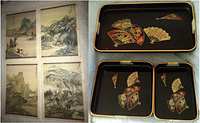 Set of 3 Japanese nesting serving trays with black lacquer background and floral fan motifs in red, gold, and black; gold rims and rattan-wrapped handles visible.
