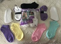 Image showing 14 pairs of various socks including Ralph Lauren, Fruit of the Loom, and other ped style low cut socks in assorted colors.