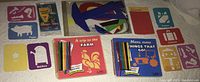 Photo showing various stencil sets laid out including storybooks, markers, and individual stencils.