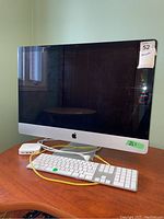 Front view showing iMac, keyboard and USB hub on desk