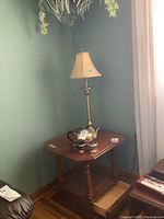 Vilas solid maple end table in corner with small open drawer, lamp and tea set on table, green wall background, curtains beside.