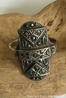 Front view of elongated Art Deco sterling silver ring with marcasite stones showing geometric design and tarnish.