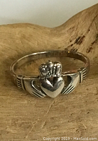 Front close-up of the sterling silver Claddagh ring featuring heart, crown, and hands design.