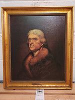 Frontal view of framed painting depicting Thomas Jefferson in fur-collared coat with ornate gold-tone frame