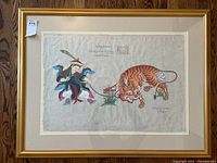 Front view of the framed Chinese art painting showing the tiger on a leash held by a figure and some Chinese script and stamps on rice paper.