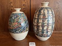 Pair of vases front view on wood background