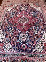Full view of carpet showing central medallion and border