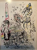 Close‐up of printed image showing two acrobatic figures and colored accents