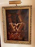 Full view of painting in ornate gilt wood frame with installed brass overhead light