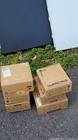 Stack of six boxed Bluedio Bluetooth headphones labeled Hurricane model.