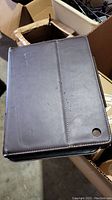Brown folio case closed