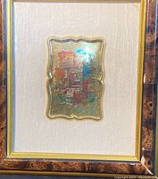 Framed small wall art with gold plated plaque showing scenic design, overall view