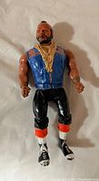 Front view of 1983 Mr. T A-Team action figure showing detailed vest, muscle arms, and gold necklaces.