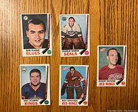 Front view of five 1969-70 O-Pee-Chee hockey cards featuring players Bob Plager, Charlie Hodge, Roger Crozier, Gerry Desjardins, and Roy Edwards.