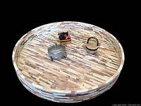 Top view of the 16-inch round tray with abalone shell pattern showing three trinket boxes placed inside.