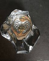 Close-up and multiple angled views of the Val St Lambert crystal paperweight with etched crab inside, showing the iceberg shape and facets.