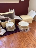 All item stacks and original Lenox boxes displayed on floor