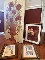 Four framed wall art pieces with one large floral painting on board and three smaller framed prints including floral and architectural themes.