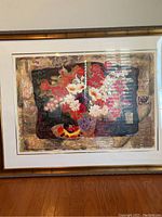 Full view of framed print with abstract floral design on textured background featuring reds, whites, and other colors.