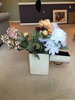 Faux flower bouquet in distressed white wooden box, featuring multiple pastel and muted color flowers with greenery
