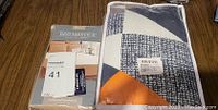 Packaging of tailored bed skirt showing Maxxell and Bed Makers branding