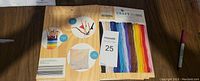 Photo showing the front label of one package with colorful strands of floss displayed.