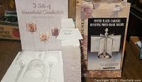 Box and packaging for 3 sets of glass candle holders and the pewter plated revolving photo frame carousel holder