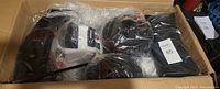 Packed components of white kids quad in bubble wrap and box