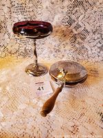 Farber Brothers Krome Kraft compote and crumb tray placed on a lace cloth background.