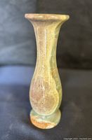 Front view showing the green and cream banded onyx vase with polished surface and smooth curved silhouette.