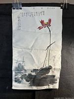 Full view of fabric silk hanging scroll featuring red lotus flower and Chinese calligraphy