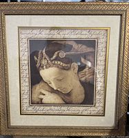 Full view of the framed 'Serene Grace' print by Sid Dickens showing detailed gilt wood frame and artwork with script border.