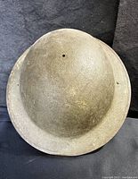 Top view showing the rounded dome and textured surface of the helmet.