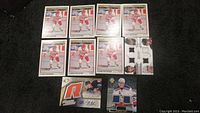 Seven Vladimir Konstantinov rookie hockey cards in red and white uniform, one Peter Nokelainen autograph jersey card, Jesper Fast rookie jersey card, and Anaheim Ducks jersey card.