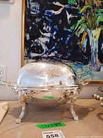 Front view of assembled warmer with dome closed on countertop