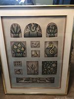 Full view of framed lithograph with multiple stylized panels featuring nature and human-animal hybrid figures.