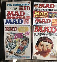 Multiple Mad Magazine Super Special issues along with The Completely Mad Don Martin book visible in lot