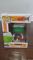 Front view of the boxed Dragon Ball Z Piccolo Funko Pop figure showing the character, number 670, and limited edition sticker.