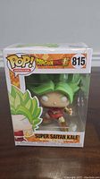 Front view of boxed Super Saiyan Kale Funko Pop figure showing character and branding.