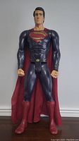 Front-facing view of large Superman figurine approximately 30 inches tall, showing detailed costume and facial features.