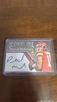 Front of the Patrick Mahomes Iconic Ink card displaying the facsimile signature and player image.