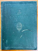 Front cover of 1930 hardcover book titled 'Canadian Homes and Gardens: The First Book of Houses' by J. Herbert Hodgins and Mary-Etta Macpherson.
