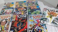 Ten X-Men comics laid out showing cover art and condition.