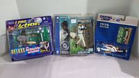 Three new baseball action figures in original packaging: Ken Griffey Jr., Matt Williams, and Ichiro figures with accessories and display features.