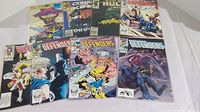 Eight Marvel Comics laid out with visible cover art including The Defenders, Conan the Barbarian, and The Incredible Hulk Weekly.