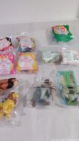 Lot of 11 toys in original packaging including Disney Bambi, Tigger The Movie, Lion King and TY Beanie Baby