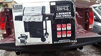 Box photo displays Backyard Grill 4 burner gas grill with side burner. Shows grill features and dimensions.