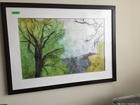 Framed watercolour print featuring green and yellow foliage, tree branches, and blue sky. Dark brown wood frame with white mat border. Print is behind glass.