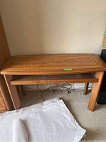 Wooden Kroehler hall table with lower shelf, showing front and side view with minor wear.
