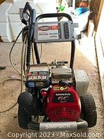 Simpson pressure washer unit with Honda GC engine on wheeled frame, high-pressure hose and wand stored